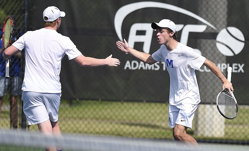 McCallie's Jordan Bruck, left, and Will Leathers celebrate a doubles point during the Blue Tornado's state-title victory over MBA on Wednesday in Murfreesboro.