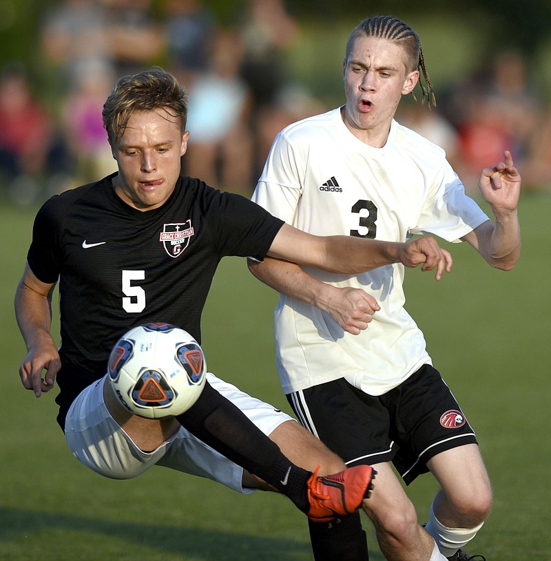 Franklin Grace's Malachi Jones (5) controls the ball in front of Signal Mountain's Aaron Easterly during a TSSAA Class A soccer state semifinal Wednesday night at the Richard Siegel Soccer Complex in Murfreesboro.