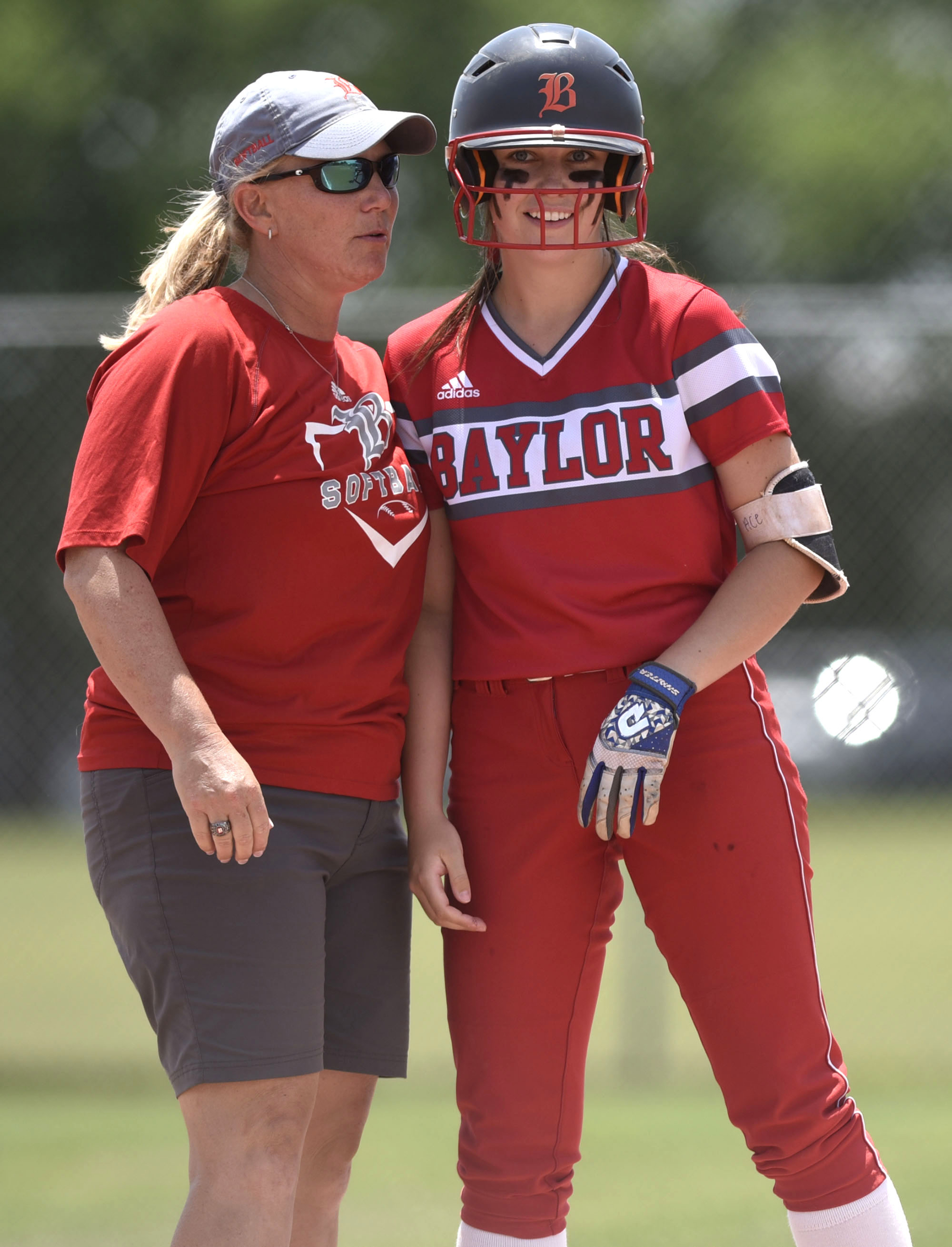 Baylor head coach Kelli Smith congratulatees Acelynn Sellers after Sellers hit a rbi triple. GPS face Baylor in the semifinals of the TSSAA Division II Class AA State Girls's softball tournament at McKnight Fields on May 22, 2019.