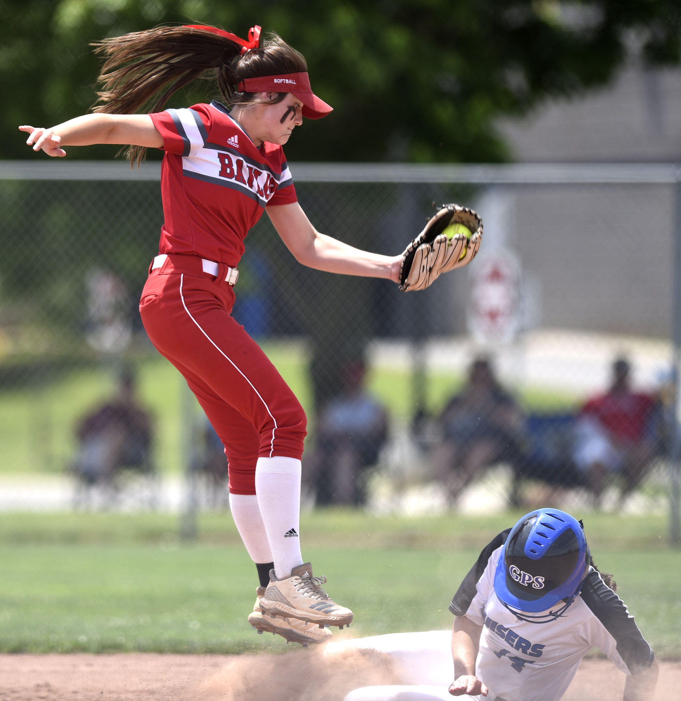 Baylor shortstop Acelynn Sellers (10) comes down with a high throw as GPS's Elizabeth Warwick (14) slides into second. GPS faced Baylor in the semifinals of the TSSAA Division II Class AA State Girls's softball tournament at McKnight Fields on May 22, 2019.