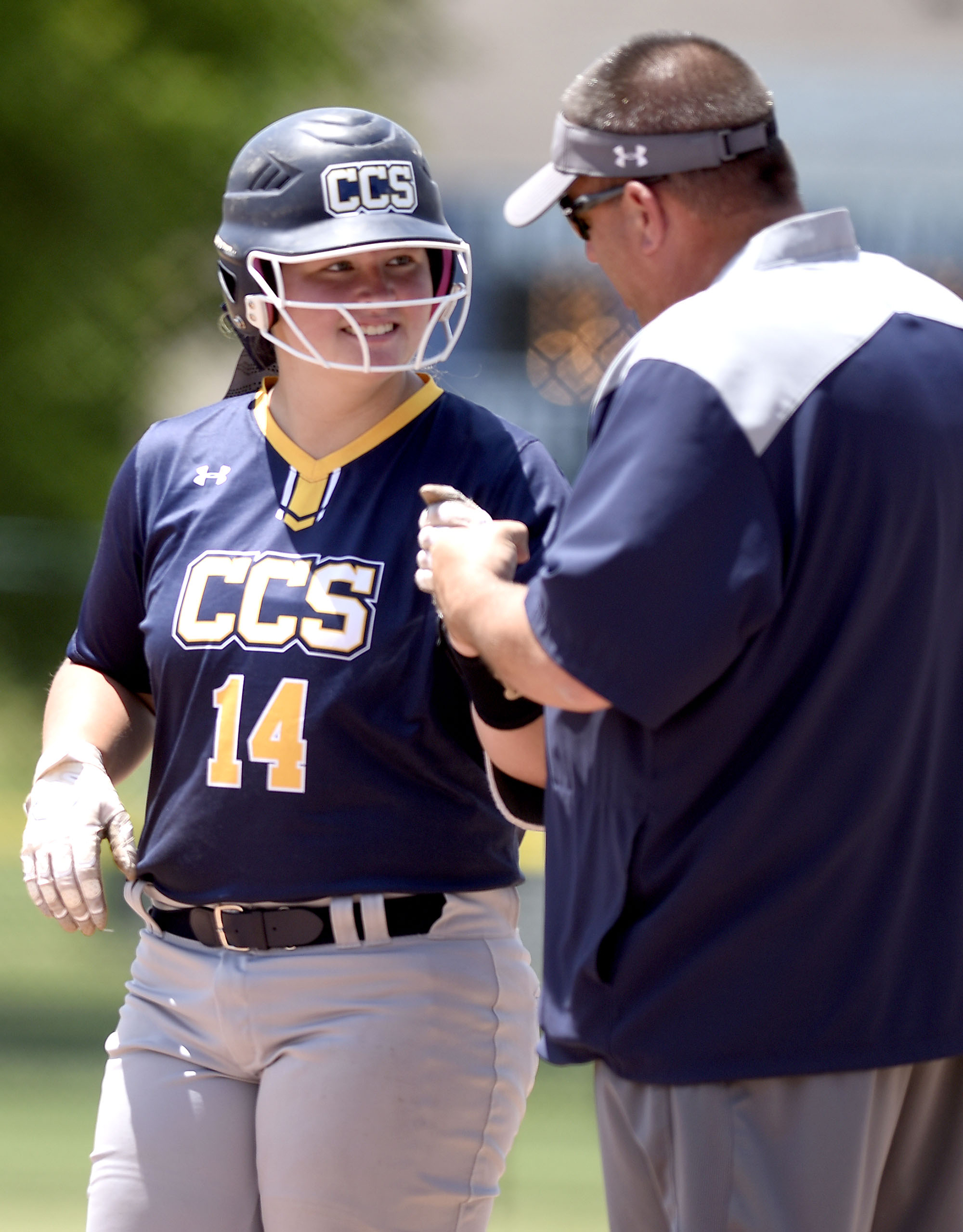 CCS's Madison Hollis (14) is congratulated by coach Brent Matthews after she hit a rbi single. Chattanooga Christian faced Davidson Academy in the quarterfinals of the TSSAA Division II Class A state girls's softball tournament held at the Starplex in Murfreesboro on May 22, 2019.