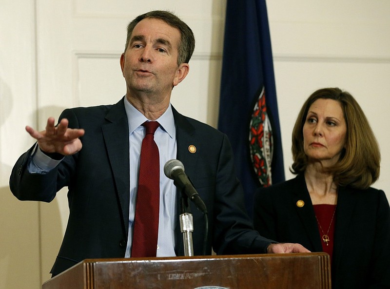 In this Feb. 2, 2019, file photo, Virginia Gov. Ralph Northam, left, gestures as his wife, Pam, listens during a news conference in the Governors Mansion at the Capitol in Richmond, Va.