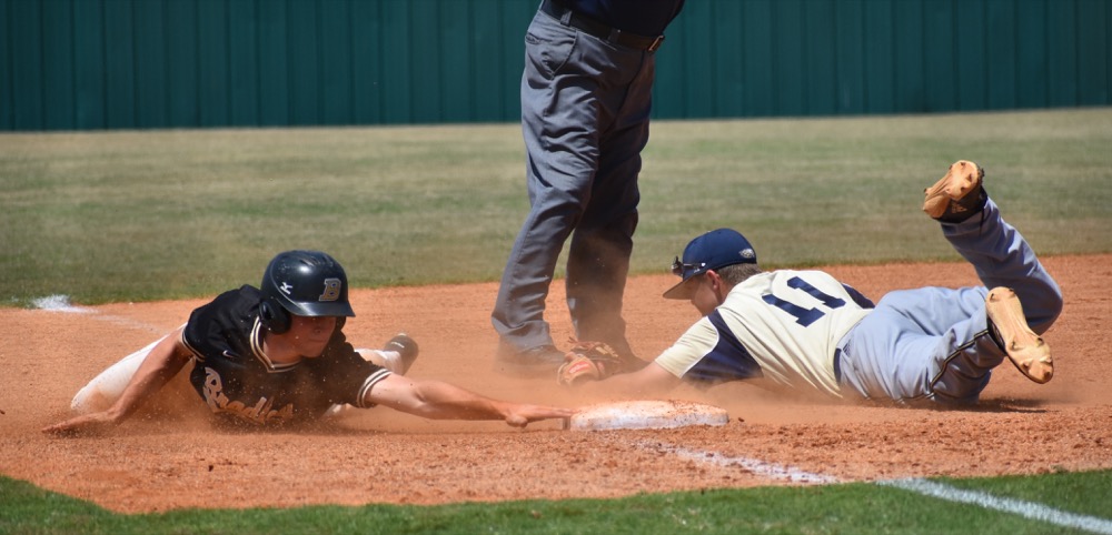 Staff photo by Patrick MacCoon /
Bradley Central's Tucker Still reaches back to third base ahead of an Independence infielder. Bradley's Bears won 6-3 in the Class AAA state tournament game Wednesday in Murfreesboro.