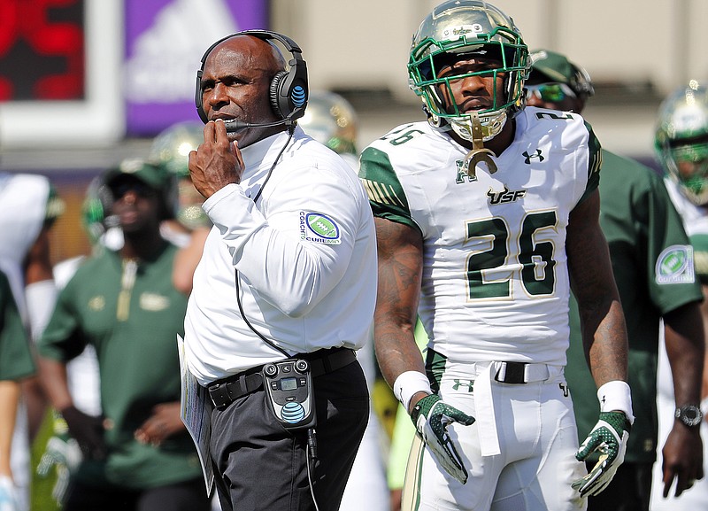 South Florida football coach Charlie Strong watches a replay during a road game in September 2017. The Bulls are scheduled to host Alabama in 2023 before visiting the Crimson Tide for games in 2024 and 2026.