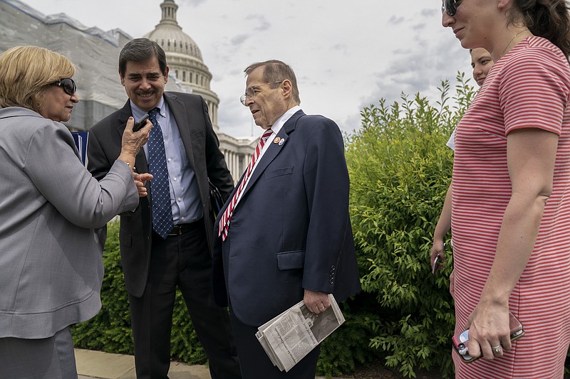 Two people ask to take a photo with House Judiciary Committee Chairman Jerrold Nadler, D-N.Y., center, as the Senate and the House of Representatives shut down for the week-long Memorial Day recess, at the Capitol in Washington, Thursday, May 23, 2019. Rep. Nadler, whose district covers parts of Manhattan and Brooklyn in New York, has gained notoriety by leading one of the House committees investigating President Donald Trump. (AP Photo/J. Scott Applewhite)