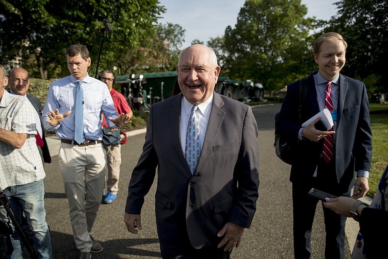 Agriculture Secretary Sonny Perdue laughs with a reporter on the North Lawn of the White House in Washington, Thursday, May 23, 2019.(AP Photo/Andrew Harnik)