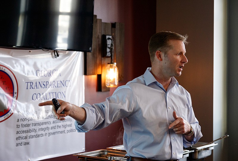 Derek Somerville speaks during a meeting of the Georgia Transparency Coalition at Farm to Fork restaurant on Thursday, May 23, 2019, in Ringgold, Ga. Somerville presented some of his personal research into Georgia House Speaker David Ralston's use of legislative leave in his private law practice.