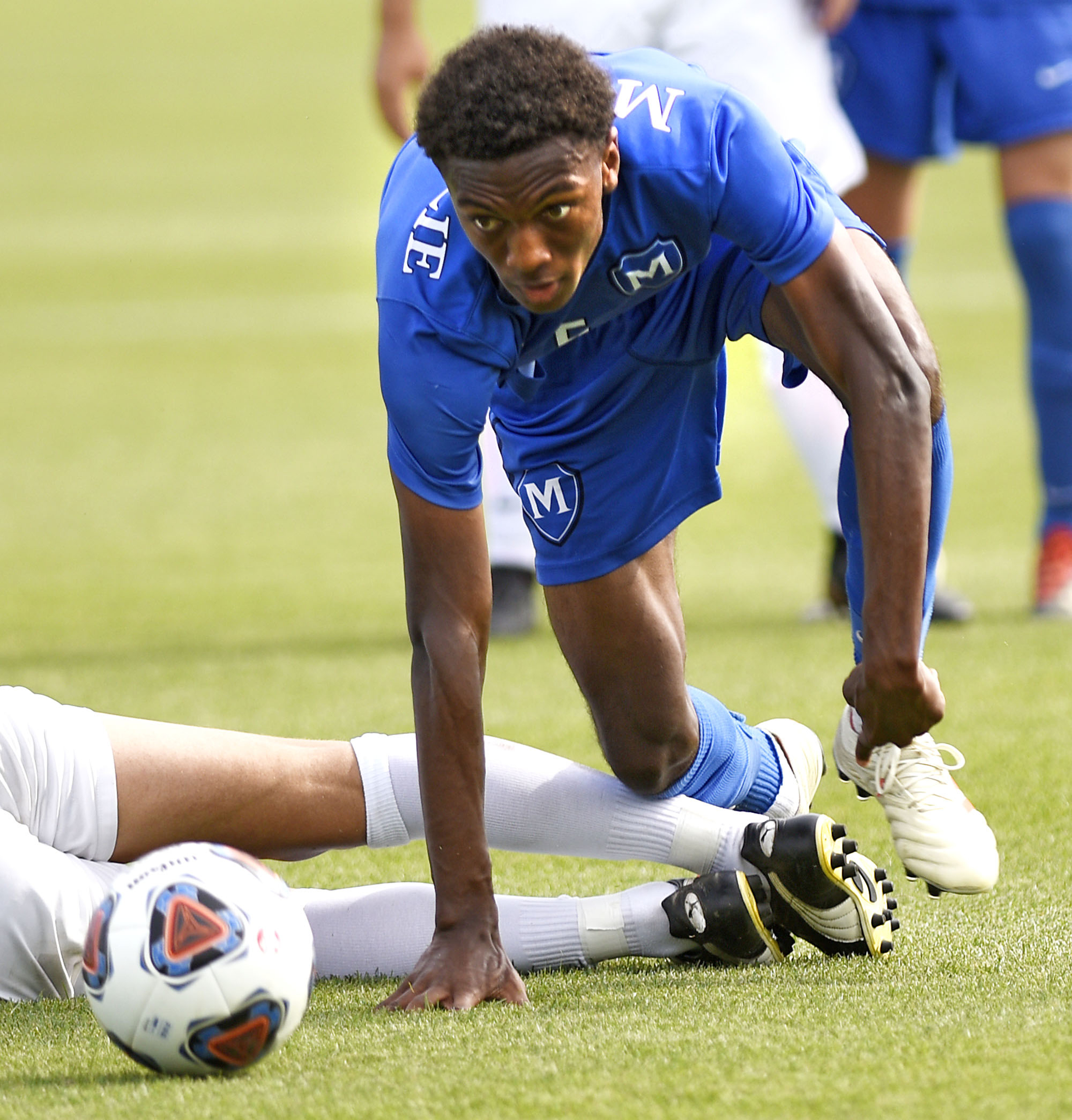 McCallie's Jonathan Richardson (5) keeps after the ball after colliding with a MBA player. McCallie faced Montgomery Bell Academy for the TSSAA Division II Class AA state soccer championship at the Richard Siegel complex on May 23, 2019.