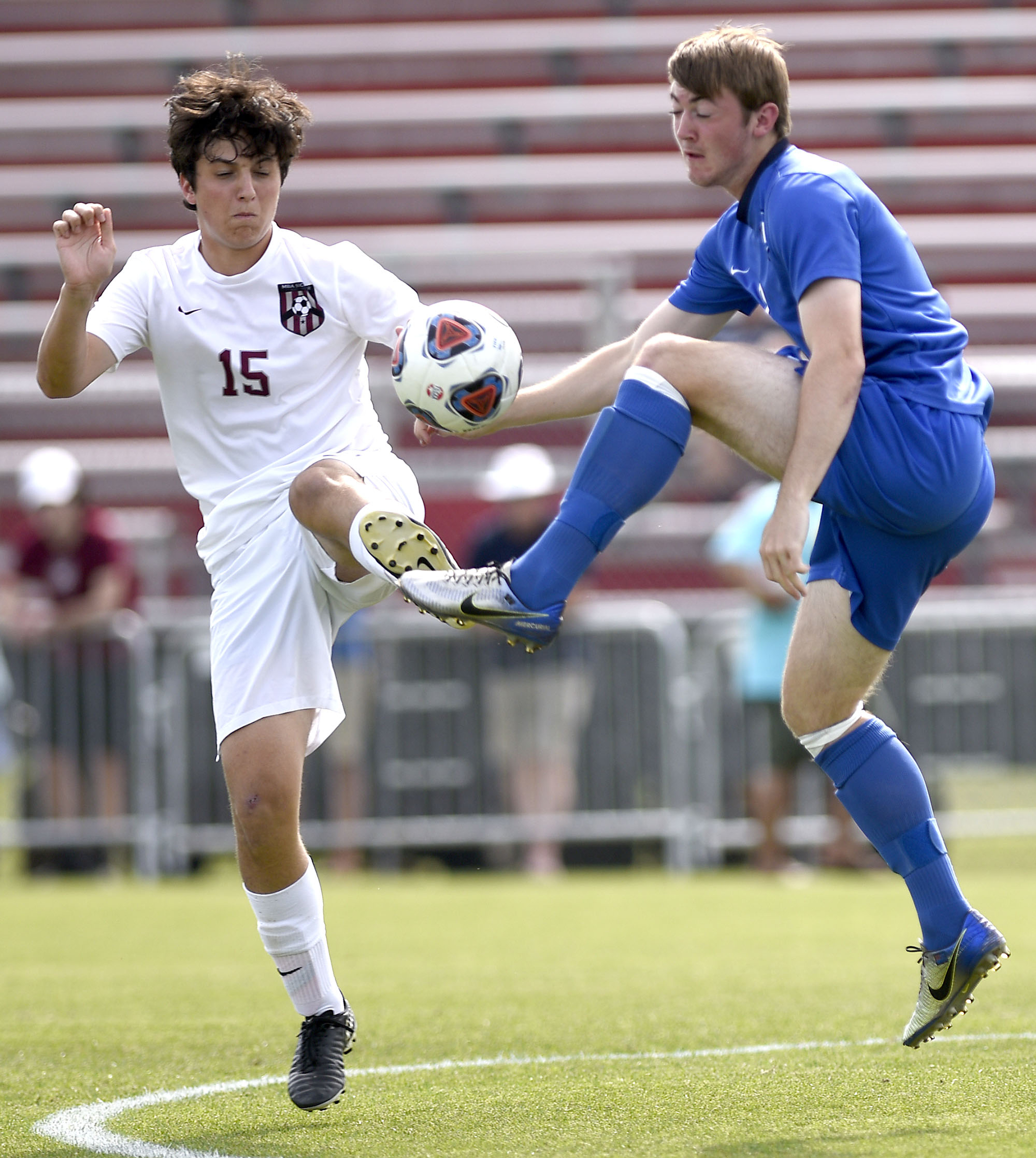 McCallie's Matthew Warbrick (7) competes for the ball with MBA's Ross Walker (15). McCallie faced Montgomery Bell Academy for the TSSAA Division II Class AA state soccer championship at the Richard Siegel complex on May 23, 2019.