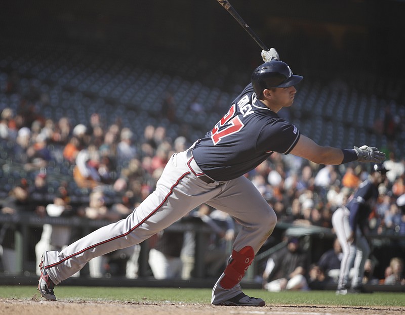 The Atlanta Braves' Austin Riley follows through on an RBI single off the San Francisco Giants' Reyes Moronta during the 13th inning of Thursday's game in San Francisco.