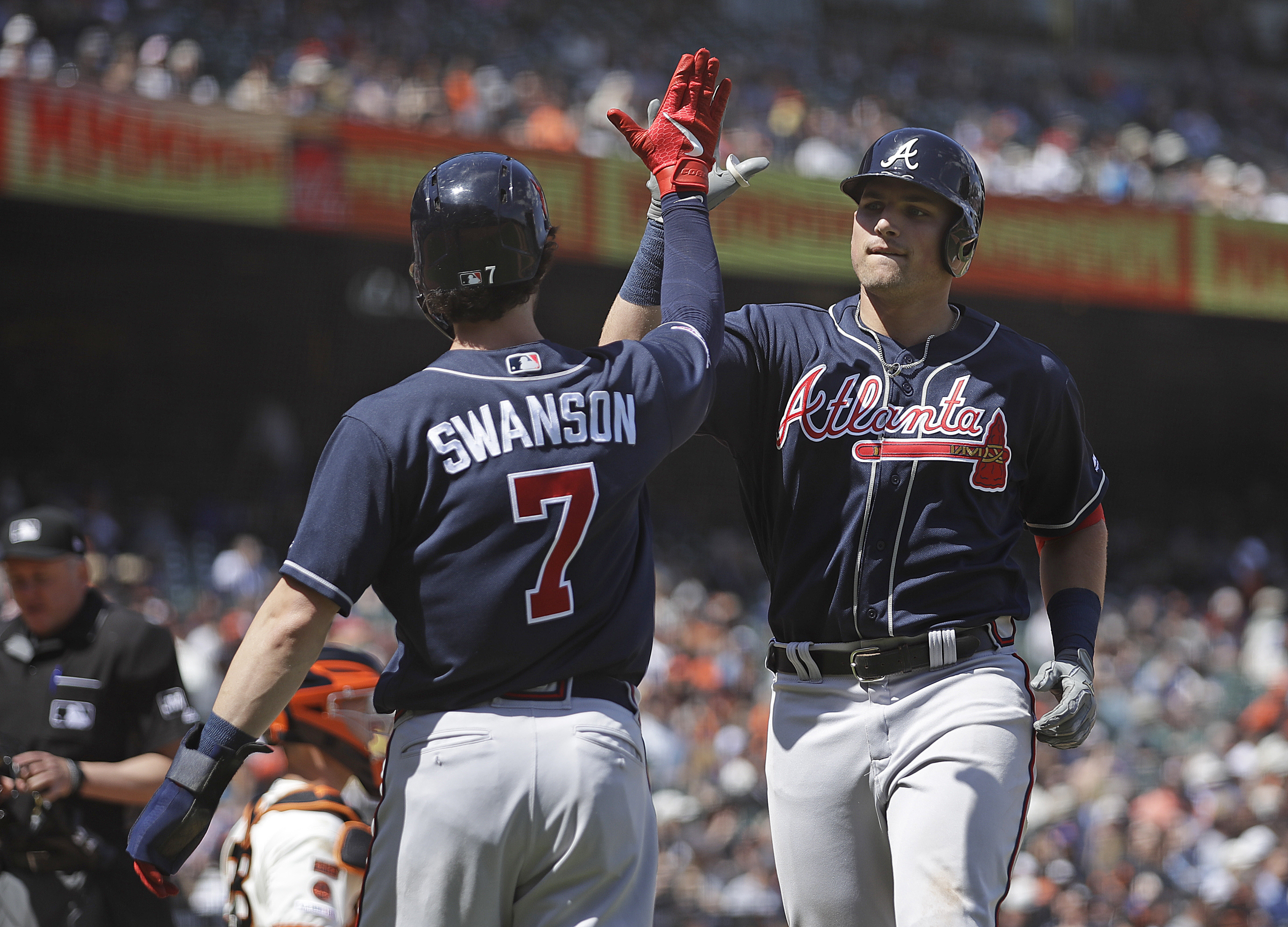 Dansby Swanson of the Atlanta Braves celebrates after hitting an RBI