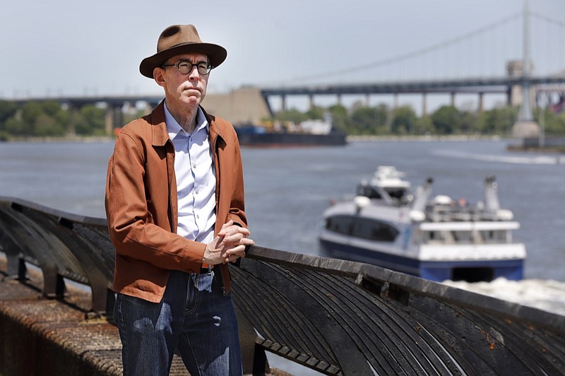Kevin Kusinitz, a 63-year-old New Yorker who spent years being rejected from jobs for which he felt overqualified following an August 2012 layoff, poses for a photo on New York's East River, Wednesday, May 22, 2019. About half of Americans think there's age discrimination in the workplace, according to a new poll by The Associated Press-NORC Center for Public Affairs Research. (AP Photo/Richard Drew)


