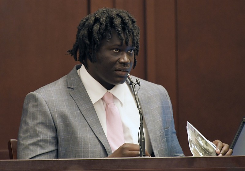 Emanuel Kidega Samson testifies in his own defense Wednesday, May 22, 2019, in Nashville, Tenn. Samson is accused of fatally shooting a woman and wounding seven people at a Nashville church in 2017. Prosecutors have said they're seeking life without parole for Samson. (Shelley Mays/The Tennessean via AP, Pool)

