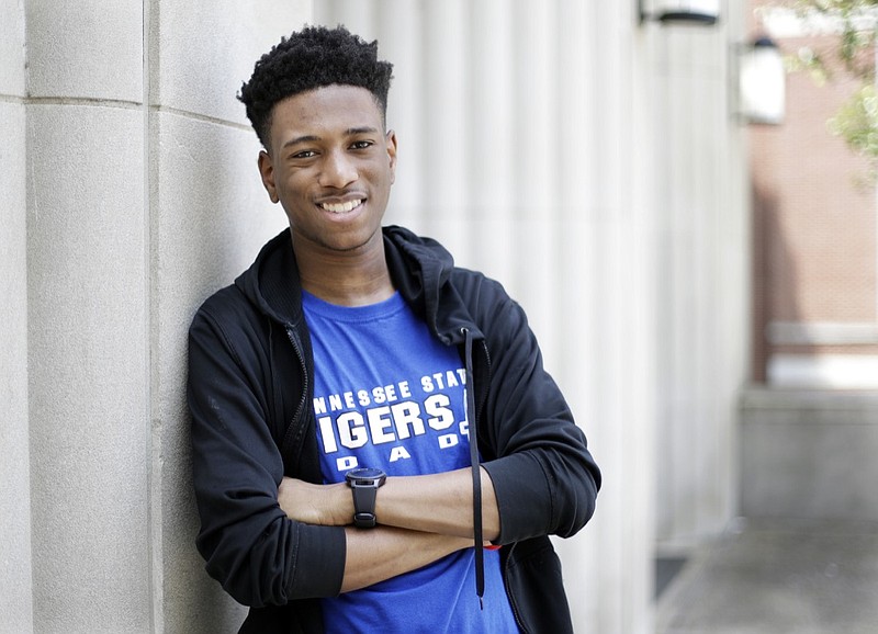 Tupac Moseley poses on the campus of Tennessee State University Thursday, May 23, 2019, in Nashville, Tenn. Moseley, who was homeless during his enrollment at Raleigh-Egypt High School in Memphis, graduated as valedictorian and received $3 million in scholarship offers. He will be attending Tennessee State. (AP Photo/Mark Humphrey)