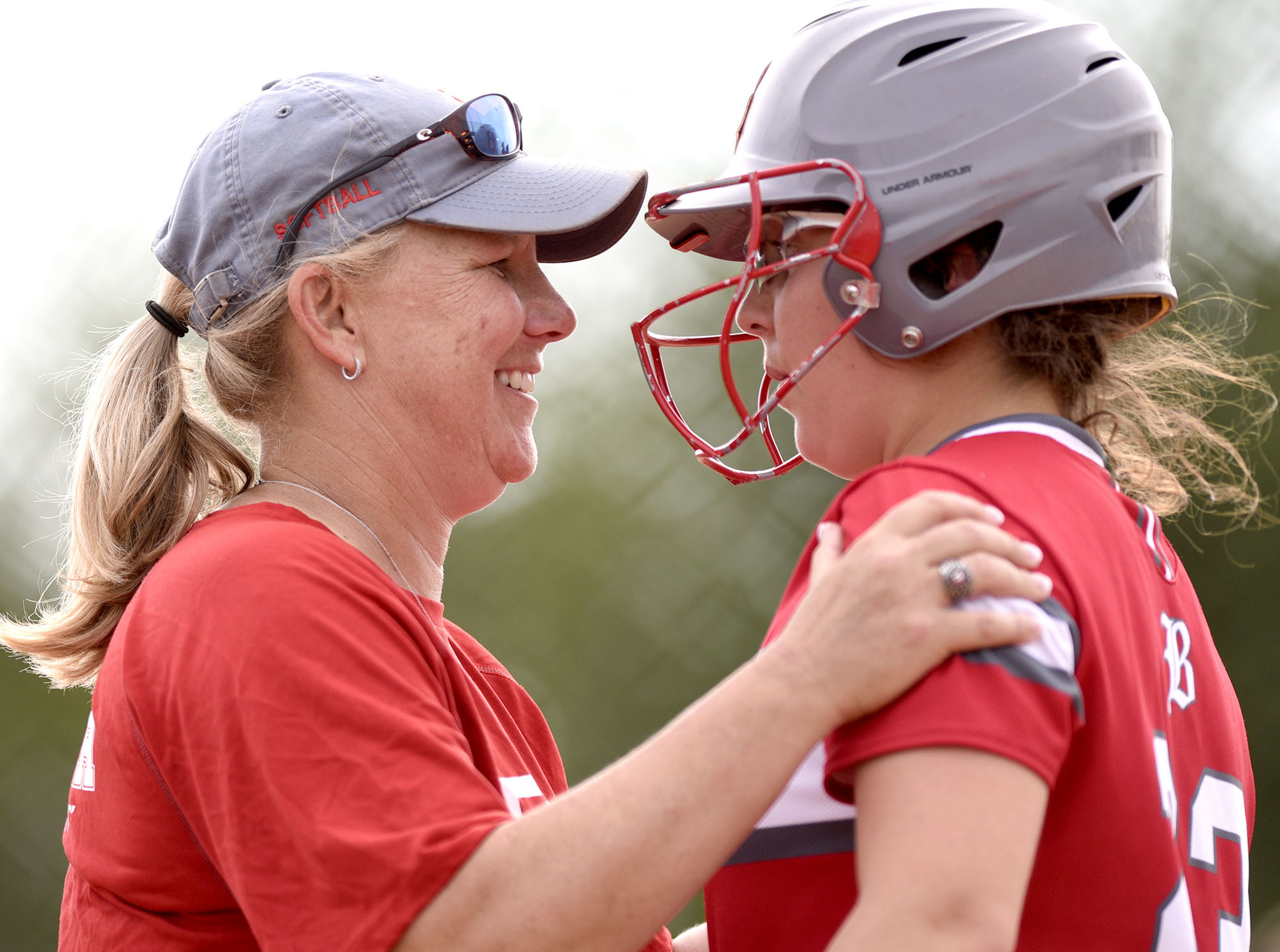 Baylor head coach Kelli Smith talks to Sophie Piskos (23) at the plate. Baylor defeated GPS 2-1 for the TSSAA Division II Class AA softball championship at the Starplex in Murfreesboro on May 23, 2019.