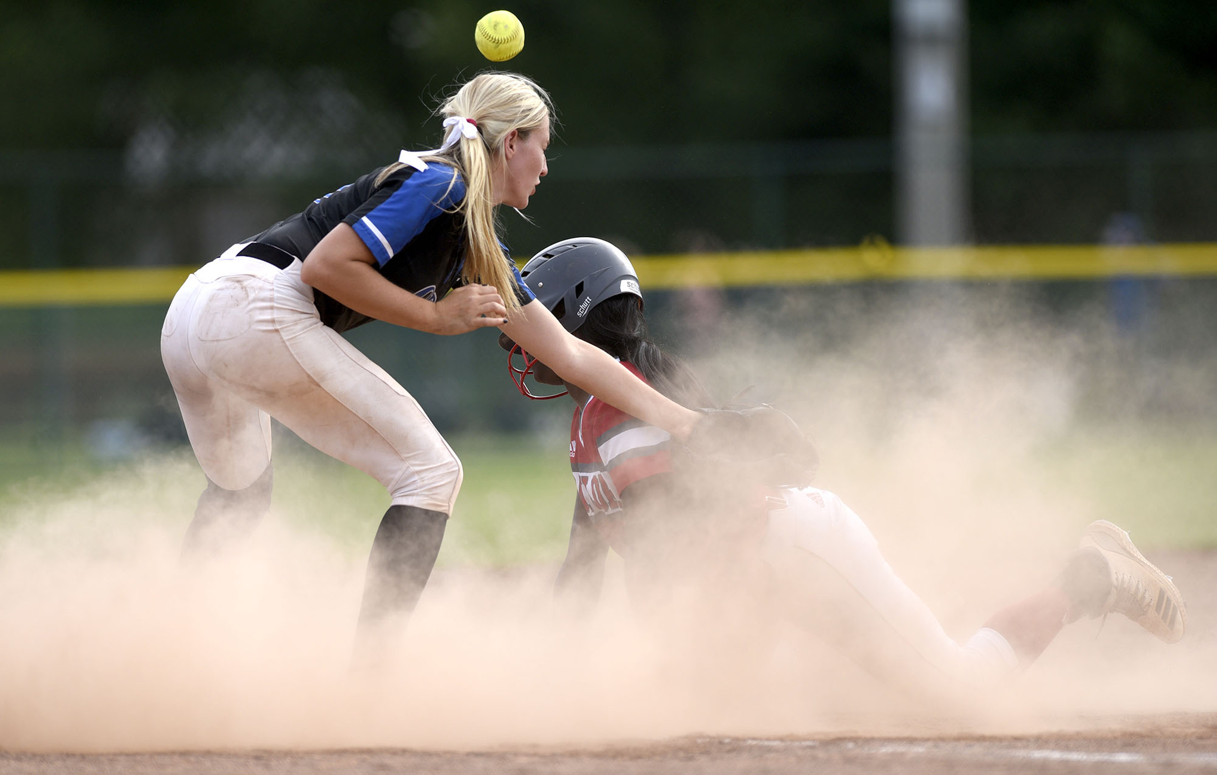 Baylor's Makayla Packer (11) is safe at third as the ball eludes GPS's Kaitlyn Songer (11). Baylor defeated GPS 2-1 for the TSSAA Division II Class AA softball championship at the Starplex in Murfreesboro on May 23, 2019.