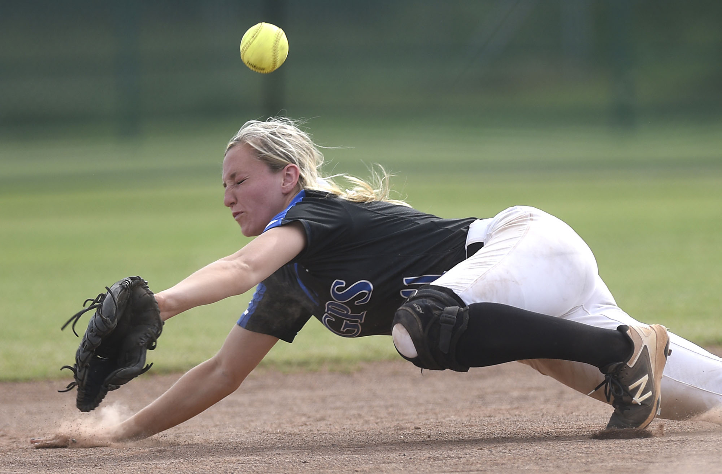 GPS shortstop Kaitlyn Songer (11) makes a diving try on a hard hit ball, but can't come up with it. Baylor defeated GPS 2-1 for the TSSAA Division II Class AA softball championship at the Starplex in Murfreesboro on May 23, 2019.