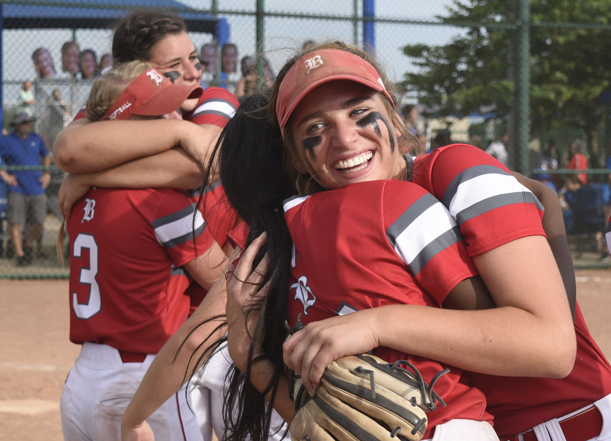 Baylor senior Brinley Garrison (12) hugs Makayla Packer (11) as the Lady Raiders win. Baylor defeated GPS 2-1 for the TSSAA Division II Class AA softball championship at the Starplex in Murfreesboro on May 23, 2019. .
