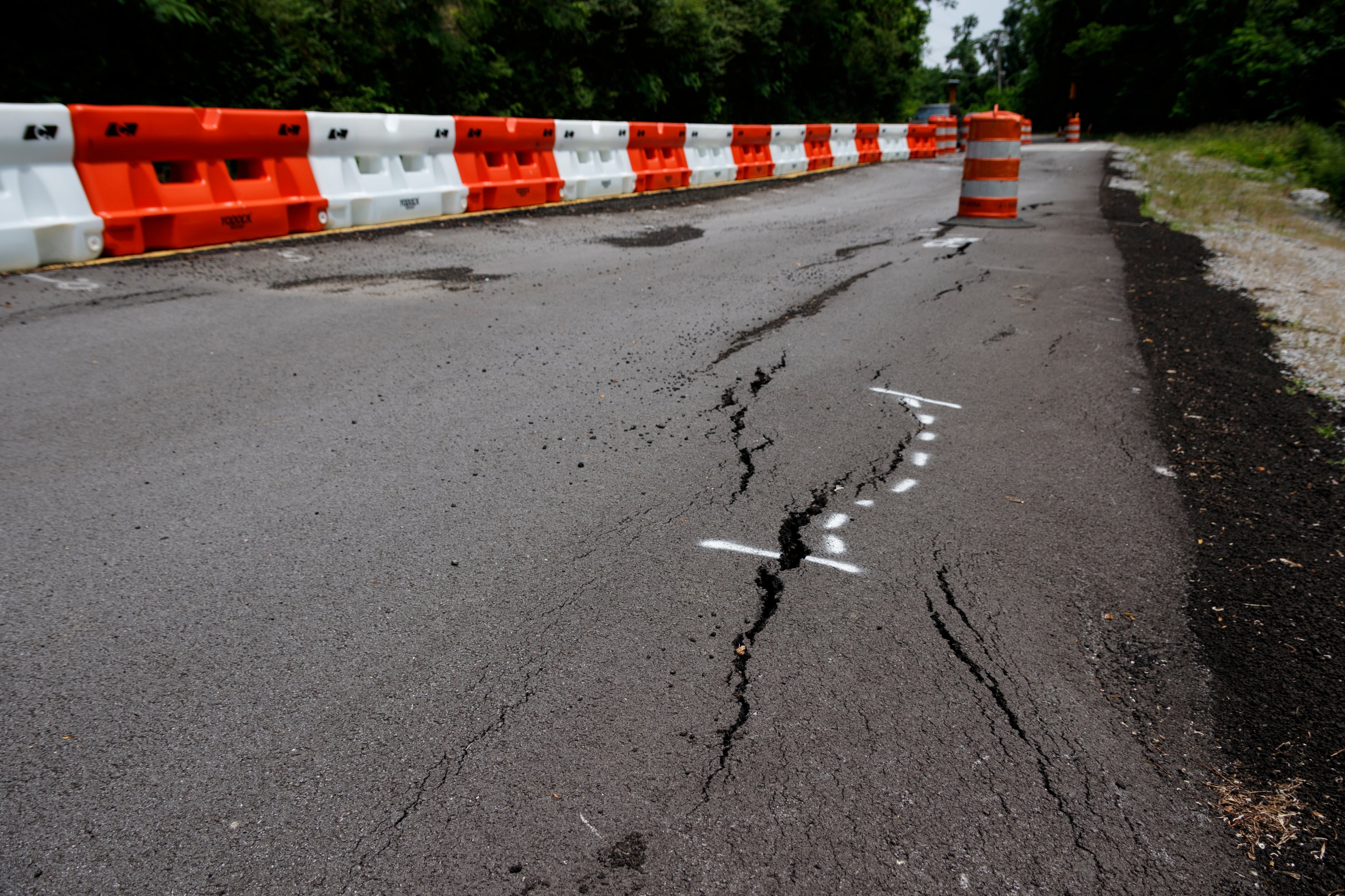 A portion of Lake Resort Drive is reduced to a single lane following damage to the roadway, seen here on Thursday, May 23, 2019, in Chattanooga, Tenn.