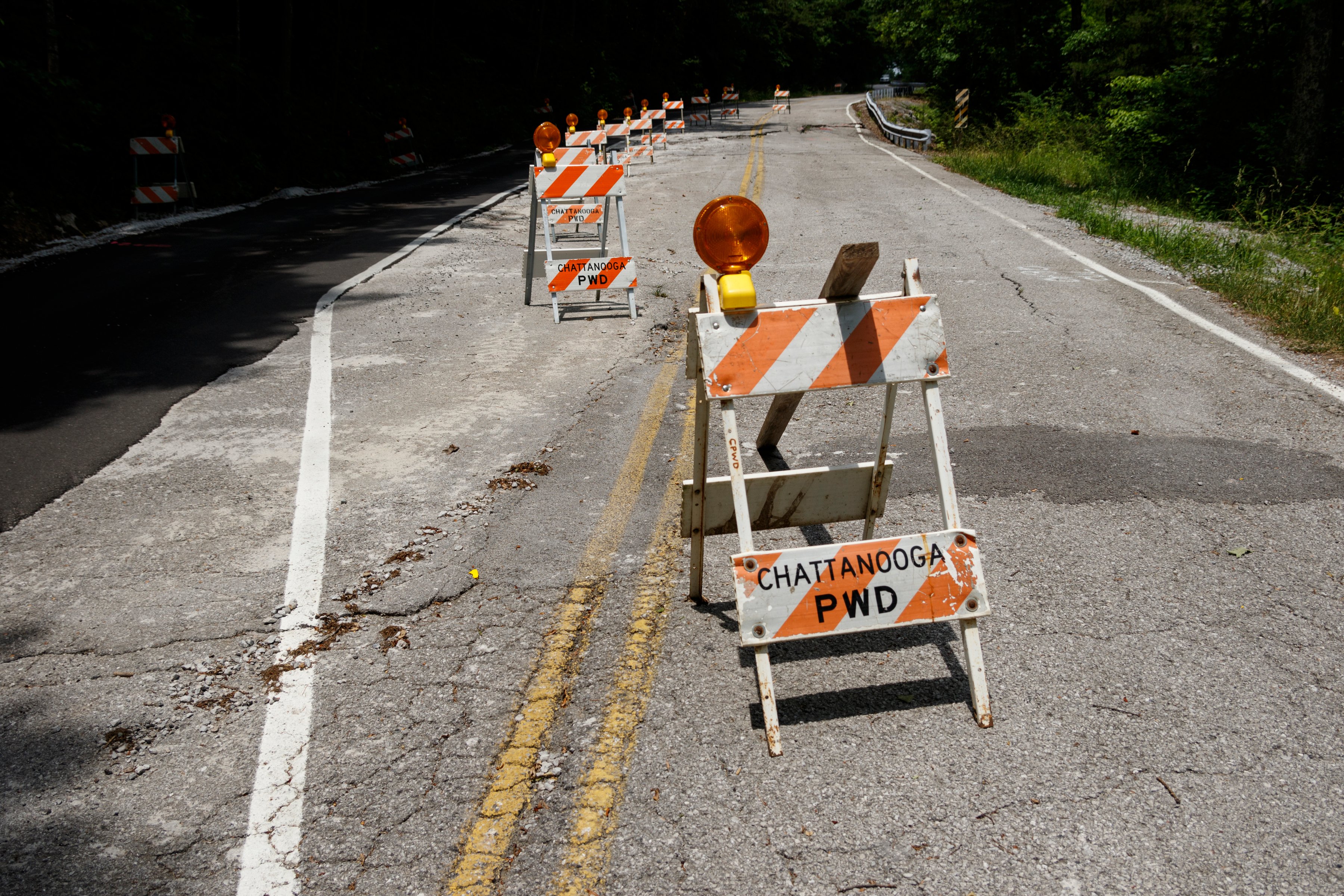 A portion of Elder Mountain Road is reduced to one land following damage to the roadway, seen here on Thursday, May 23, 2019, in Chattanooga, Tenn.