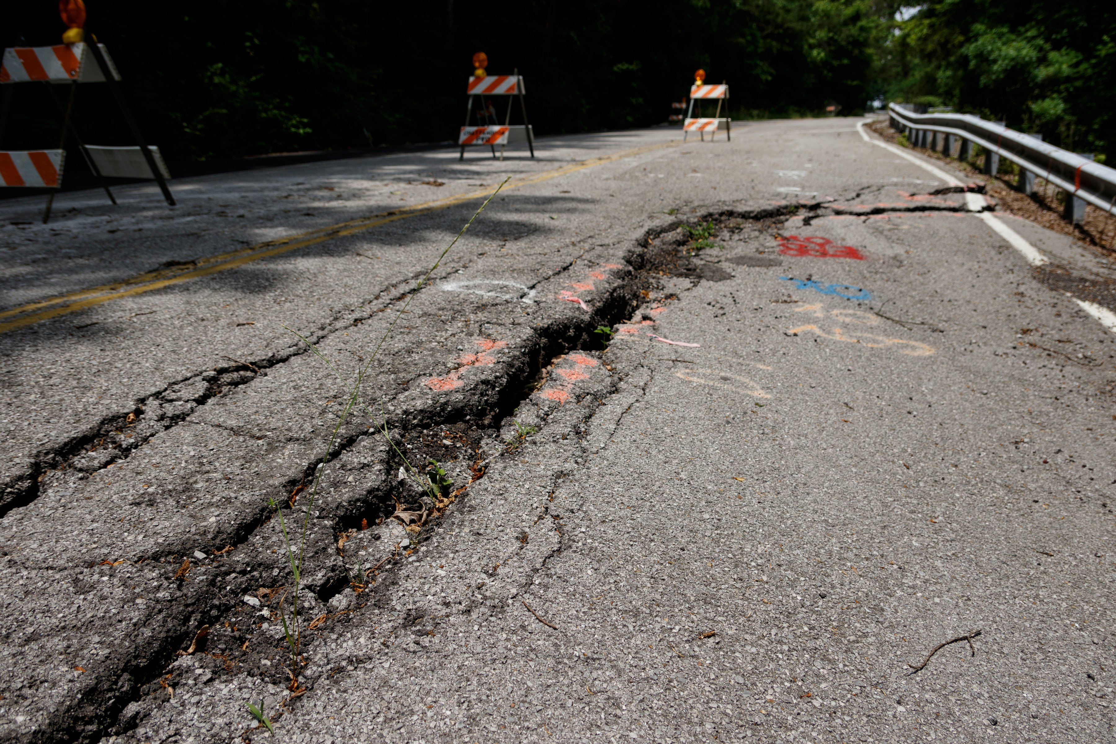 A portion of Elder Mountain Road is reduced to one land following damage to the roadway, seen here on Thursday, May 23, 2019, in Chattanooga, Tenn.