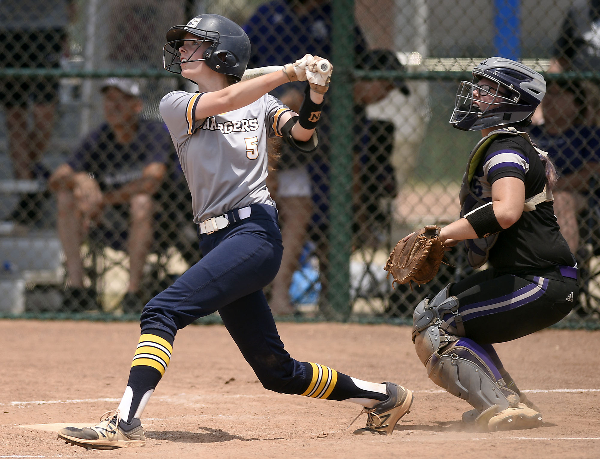 CCS's Madison Blevins (5) watches her hit fly into centerfield. Chattanooga Christian School lost to King's Academy 3-1 in the finals of the TSSAA Division II Class A softball championship held at the Starplex in Murfreesboro on May 24, 2019.