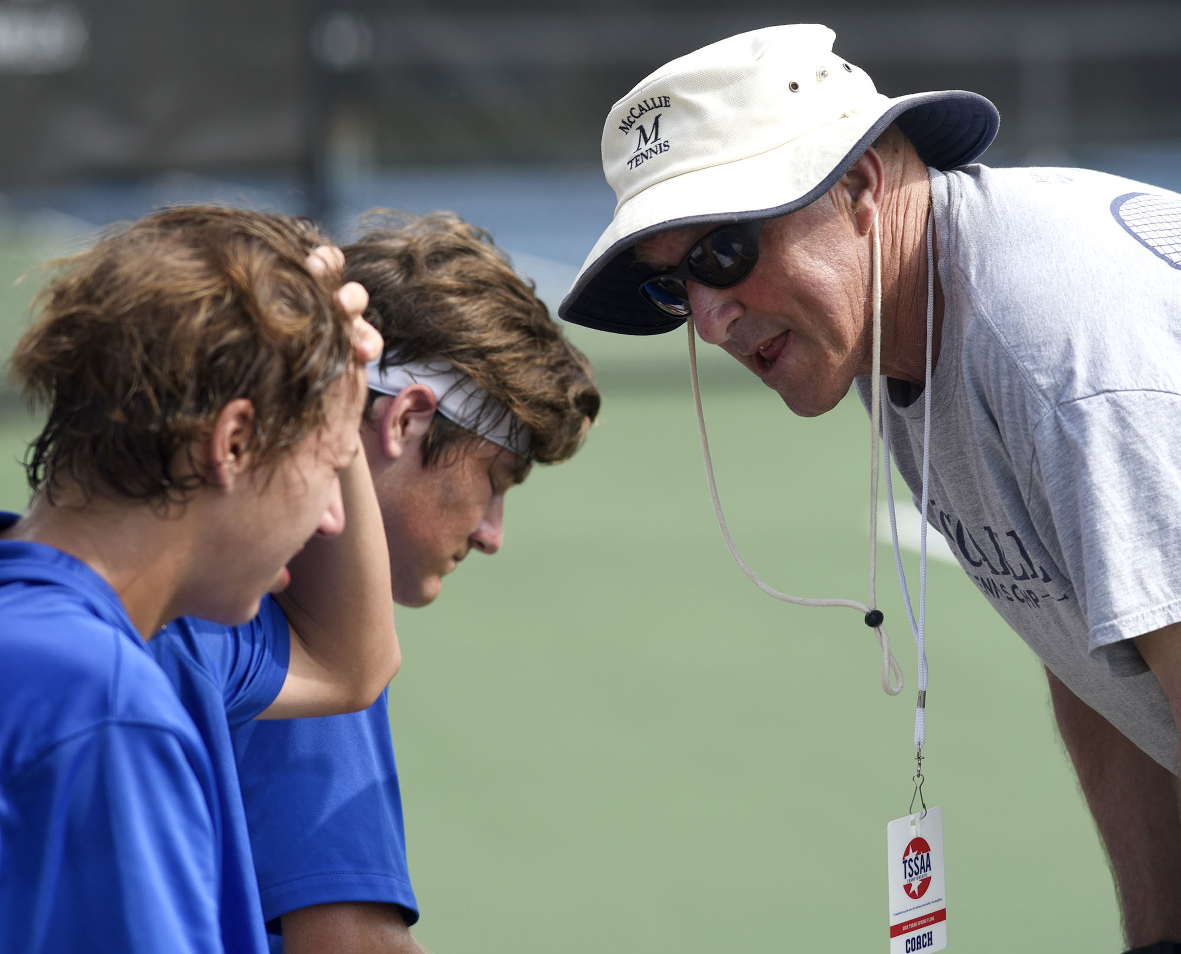 McCallie, from left, Charlie Park and John Knight are encourage by assistant coach Gary McIntyre during a break in their match with Baylor's Benji Taverne and Hunter Smith. The finals of the TSSAA Tennis Tournament were held at the Adams Tennis Complex in Murfreesboro on May 24, 2019.