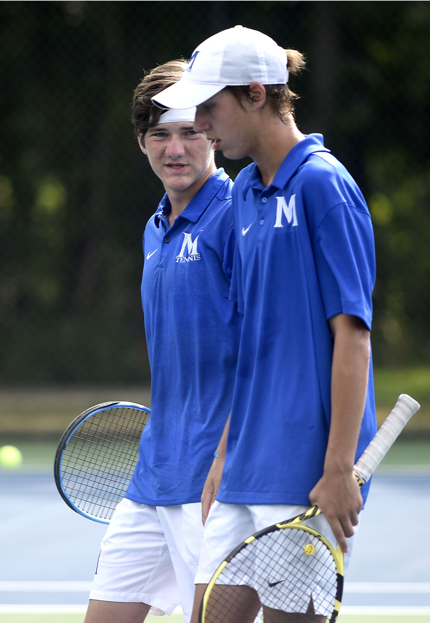 McCallie's John Knight, left, and Charlie Park discuss tactics in their match with Baylors Benji Taverne and Hunter Smith. The finals of the TSSAA Tennis Tournament were held at the Adams Tennis Complex in Murfreesboro on May 24, 2019.