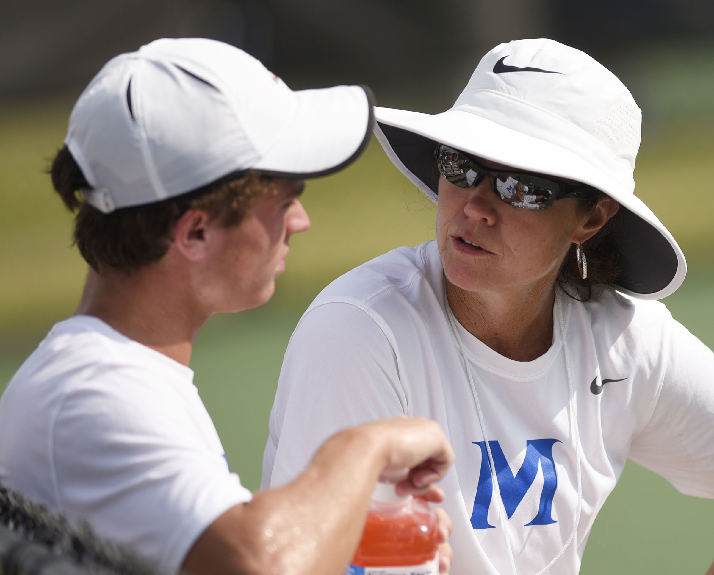 McCallie assistant coach Meg Bandy instructs Will Leathers in a break from his match with MBA's Baylor Sai. The finals of the TSSAA Tennis Tournament were held at the Adams Tennis Complex in Murfreesboro on May 24, 2019.
