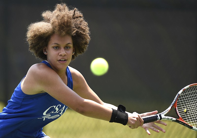 Arts & Sciences tennis player Sunshine Finnell reaches to hit a backhand in her Division I Small Class girls' singles state final against Brittney Combest of Memphis Middle College High School on Friday at the Adams Tennis Complex in Murfreesboro.