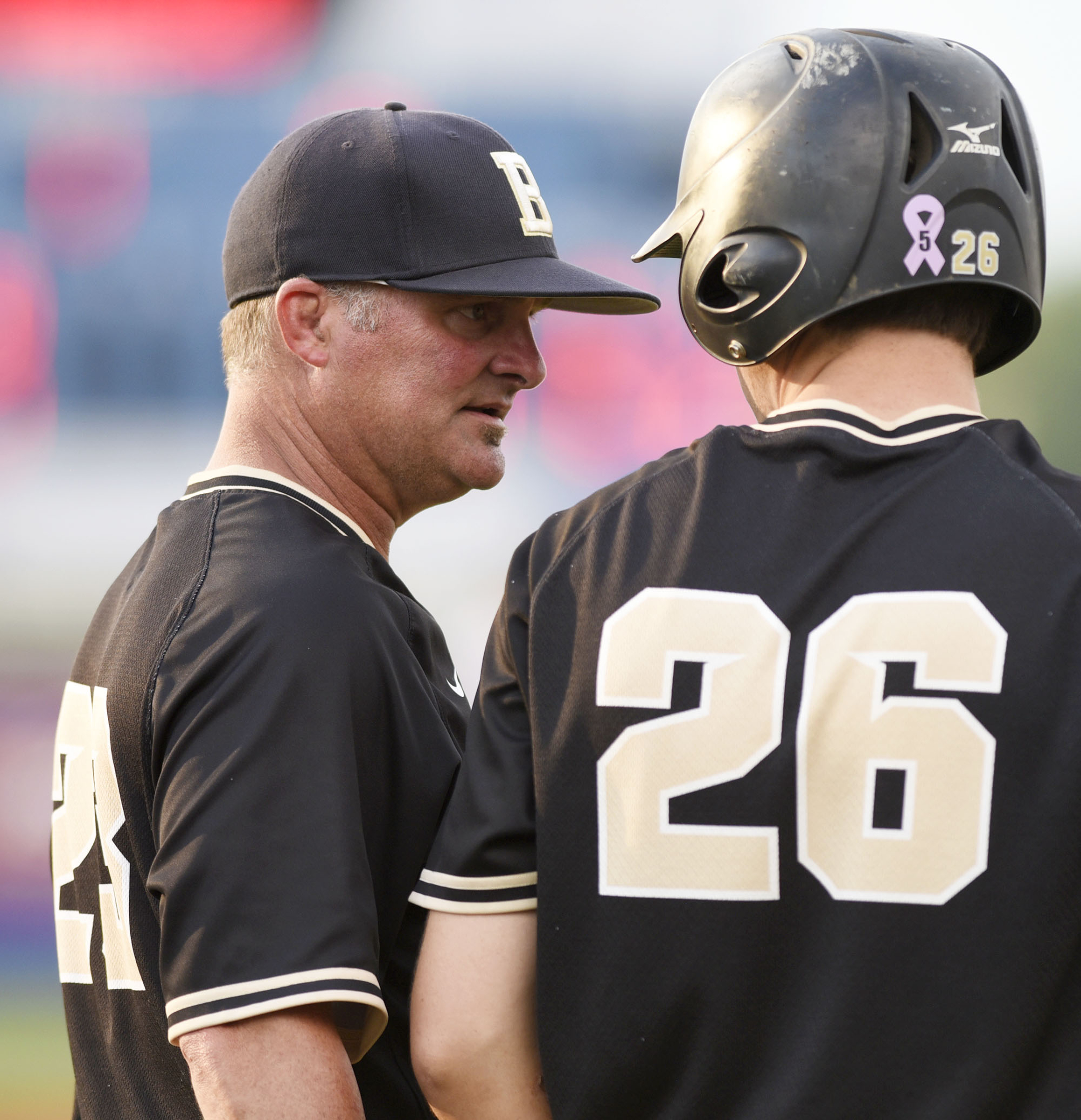 Bradley head coach Travis Adams steadies Tucker Still (26) in the top of the 7th inning. The Bradley Central Bears lost to the Farragut Admirals in the championship game of the TSSAA Class AAA baseball tournament at Reese Smith Jr. Field on the campus of Middle Tennessee University in Murfreesboro on May 24, 2019.