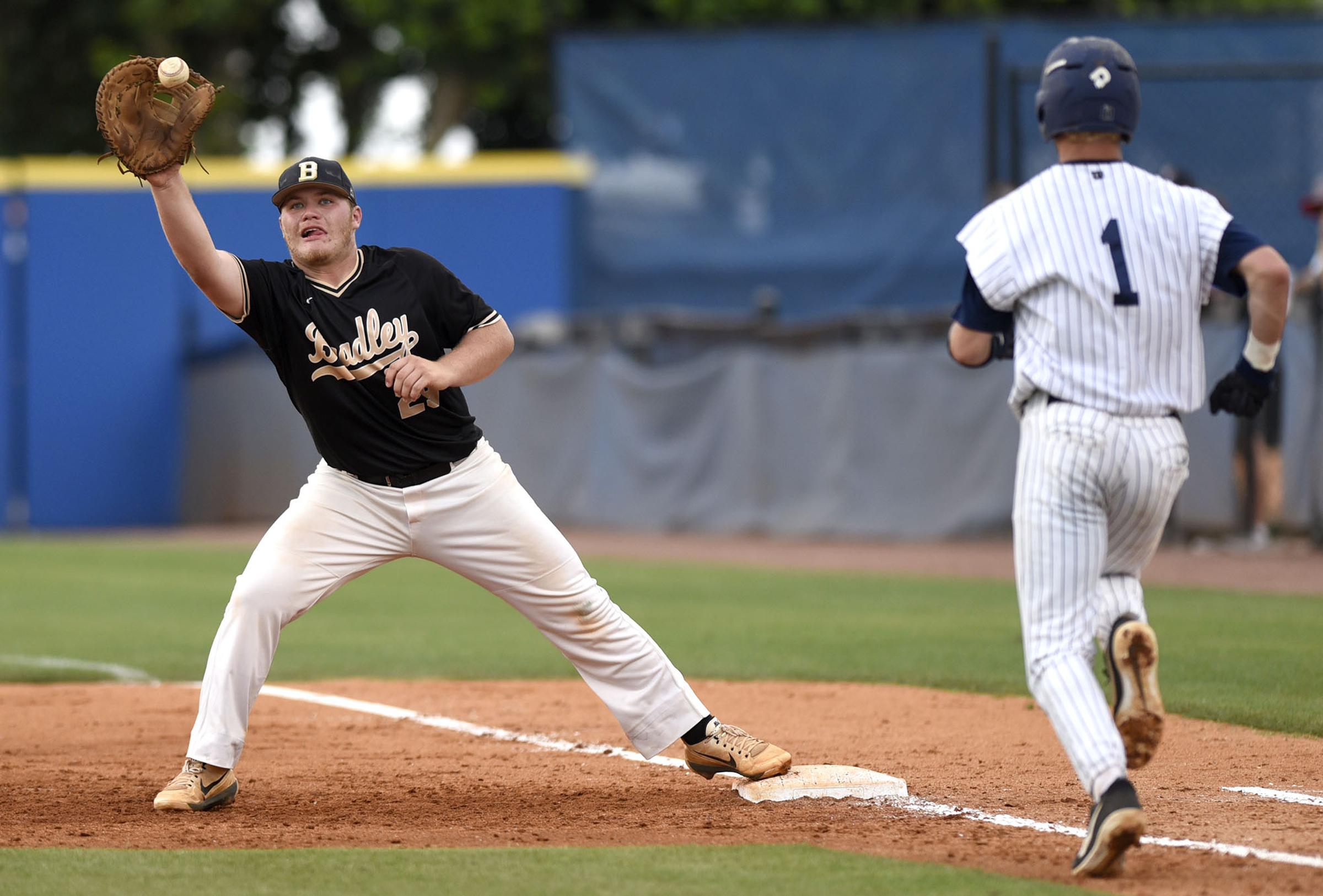 Braldey first baseman Jake Thompson (29) catches the ball to put a Farragut runner out. The Bradley Central Bears lost to the Farragut Admirals in the championship game of the TSSAA Class AAA baseball tournament at Reese Smith Jr. Field on the campus of Middle Tennessee University in Murfreesboro on May 24, 2019.