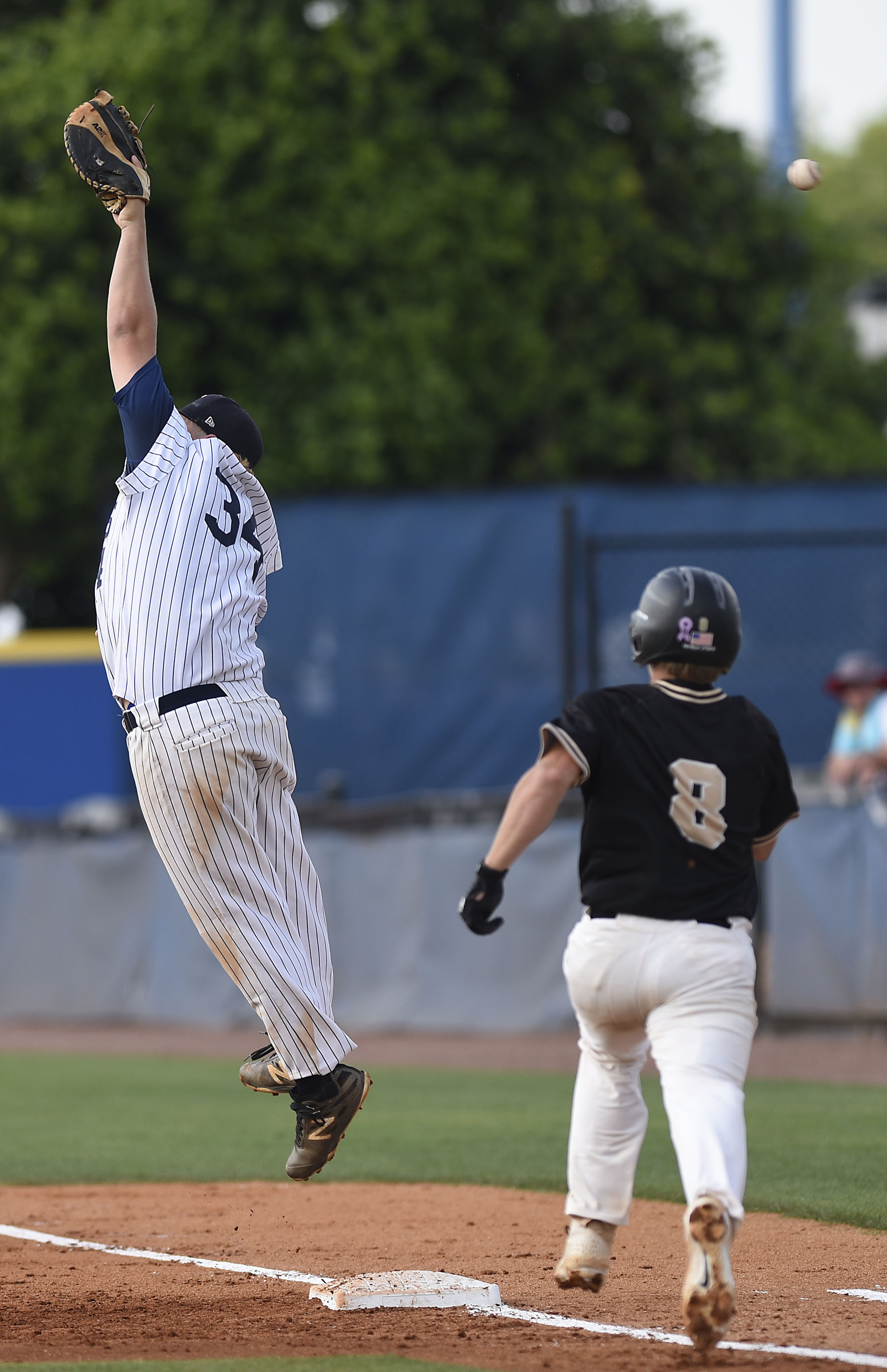 Bradley's Dylan Standifer is safe at first as the ball sails over the head of the Farragut first baseman. The Bradley Central Bears lost to the Farragut Admirals in the championship game of the TSSAA Class AAA baseball tournament at Reese Smith Jr. Field on the campus of Middle Tennessee University in Murfreesboro on May 24, 2019.