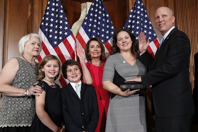 In this Jan. 3, 20-19, file photo, House Speaker Nancy Pelosi of Calif., left, poses during a ceremonial swearing-in with Rep. Chip Roy, R-Texas, right, on Capitol Hill in Washington. Roy, complaining of Washington's free-spending ways has blocked a long-overdue $19 billion disaster aid bill. That extends a battle over hurricane and flood relief. Roy objected to speeding the measure through a nearly-empty chamber on Friday (AP Photo/Alex Brandon, File)