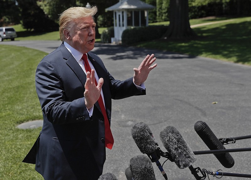 President Donald Trump speaks to members of the media on the South Lawn of the White House in Washington, Friday, May 24, 2019, before boarding Marine One for a short trip to Andrews Air Force Base, Md., and then on to Tokyo. (AP Photo/Pablo Martinez Monsivais)

