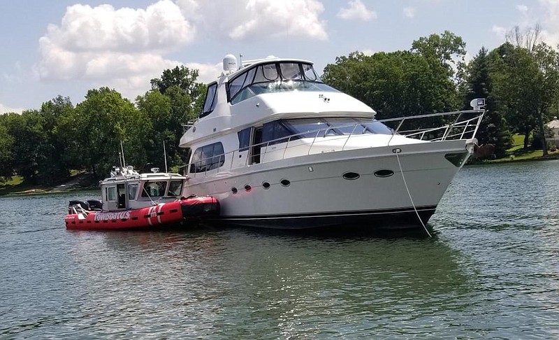 Firefighters respond to a fire aboard a million-dollar boat at the Chattanooga Yacht Club on Saturday.