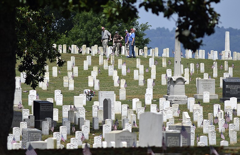People walk through the ground of the National Cemetery after the ceremony.  The Chattanooga Area Veterans Council hosted the Memorial Day ceremony at the Chattanooga National Cemetery on May 27, 2019.  