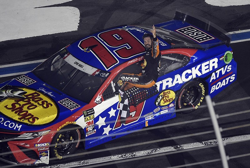 Martin Truex Jr. celebrates his Coca-Cola 600 victory Sunday night at Charlotte Motor Speedway in Concord, N.C.