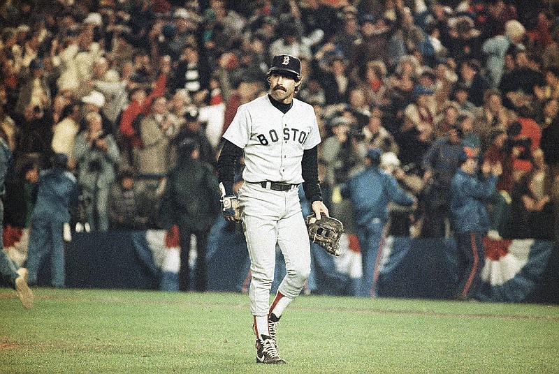 Boston Red Sox first baseman Bill Buckner is a picture of dejection as he leaves the field after committing an error that allowed the New York Mets to score the winning run in the sixth game of the 1986 World Series. / AP File Photo/Rusty Kennedy