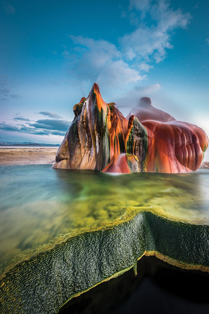 The minerals expelled from Fly Geyser is what produces the vibrant colors of this mysterious rock formation.