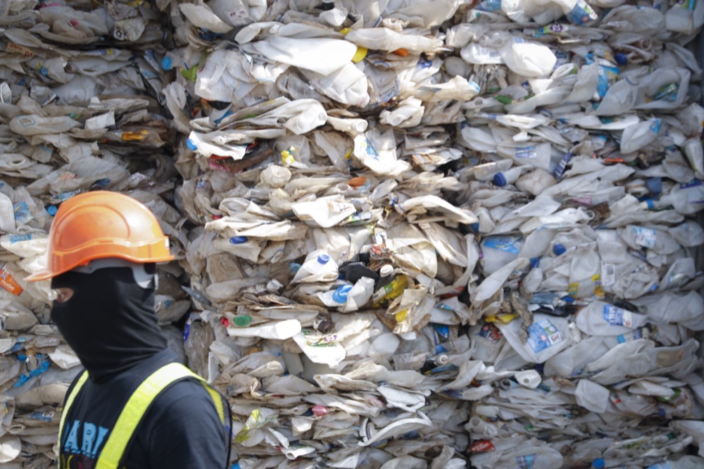 A container is filled with plastic waste from Australia, in Port Klang, Malaysia, Tuesday, May 28, 2019. Malaysia says it will send back some 3,000 metric tonnes (330 tons) of non-recyclable plastic waste to countries including the U.S., U.K., Canada and Australia in a move to avoid becoming a dumping ground for rich nations. (AP Photo / Vincent Thian)