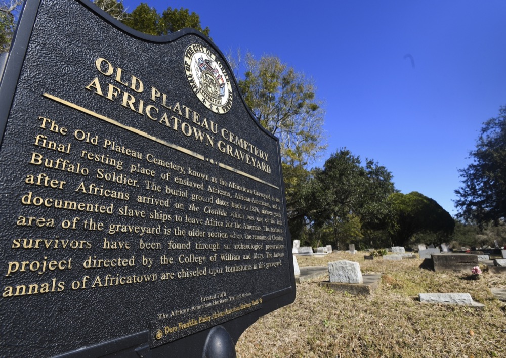 FILE - In this Tuesday, Jan. 29, 2019, file photo, Old Plateau Cemetery, the final resting place for many who spent their lives in Africatown, stands in need of upkeep near Mobile, Ala. Many of the survivors of the slave ship Clotilda's voyage are buried here among the trees. On Wednesday, May 22, 2019, authorities said that researchers have located the wreck of Clotilda, the last ship known to bring enslaved people from Africa to the United States. (AP Photo/Julie Bennett, File)