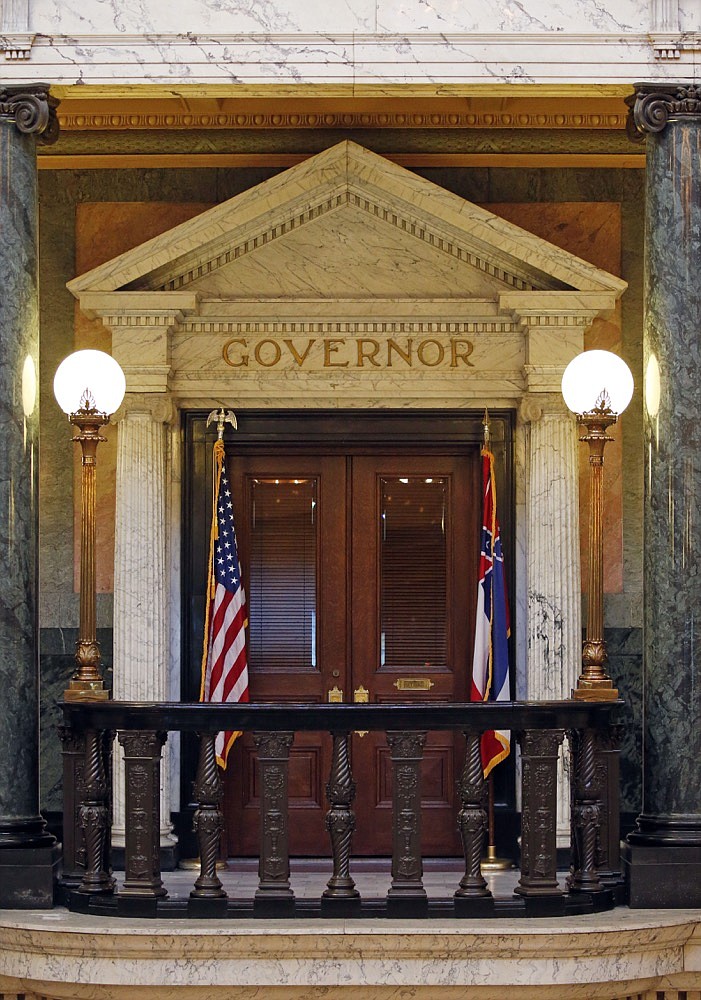 The title of governor rests above the entrance to the office at the Mississippi State Capitol in Jackson, Miss., Wednesday, May 29, 2019. A federal lawsuit being filed Thursday, seeks an injunction in this year's elections against using what it describes as a "racist electoral scheme" that "intentionally and effectively dilutes African American voting strength." To win elections in Mississippi, candidates for statewide offices must receive a majority of the popular vote and win at least 62 of the 122 state House of Representatives districts. Mississippi is the only state that requires statewide candidates to win in the majority of state House districts. (AP Photo/Rogelio V. Solis)

