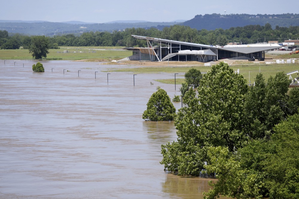 The Arkansas River floods the area near the U.S. Marshals Museum in Fort Smith, Ark., Thursday, May 30, 2019. (AP Photo/Michael Woods)