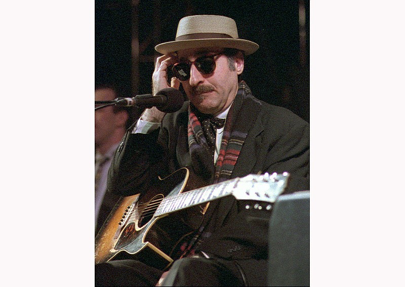 This March 28, 1998 file photo shows Leon Redbone performing at the eighth annual Redwood Coast Dixieland Jazz Festival in Eureka, Calif. Redbone, the acclaimed singer and guitarist who performed jazz, ragtime and Tin Pan Alley-styled songs, died Thursday, May 30, 2019, according to a statement released by his family. No details about his death were provided. (Patricia Wilson/The Times-Standard via AP, File)