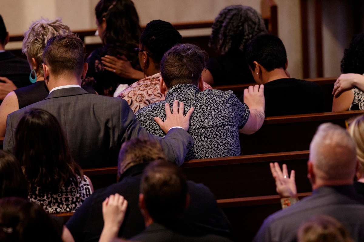 Mourners embrace during the funeral service for Christian author Rachel Held Evans at First-Centenary United Methodist Church on Saturday, June 1, 2019, in Chattanooga, Tenn. Evans was a Dayton, Tenn., resident who authored books including "A Year of Biblical Womanhood," "Searching for Sunday" and "Inspired: Slaying Giants, Walking on Water, and Loving the Bible Again."