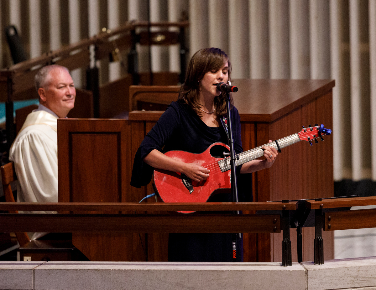 Amanda Held Opelt gives a sings a song for her sister, author Rachel Held Evans, during her funeral at First-Centenary United Methodist Church on Saturday, June 1, 2019, in Chattanooga, Tenn. Evans was a Dayton, Tenn., resident who authored books including "A Year of Biblical Womanhood," "Searching for Sunday" and "Inspired: Slaying Giants, Walking on Water, and Loving the Bible Again."