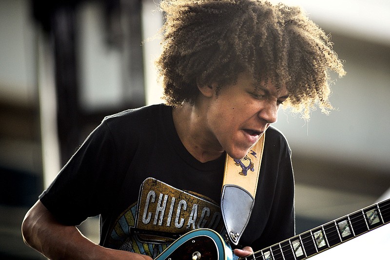 Brandon ҔazӠNiederauer grimaces as he plays a guitar solo on the Bud Lite Stage.  15-year old Niedarauer started playing when he was 8 and has played with many famous musicians such as Gregg Allman and Lady Gaga.  Macklemore was the featured act on the final night of the 2019 Riverbend Festival on June 1, 2019.  