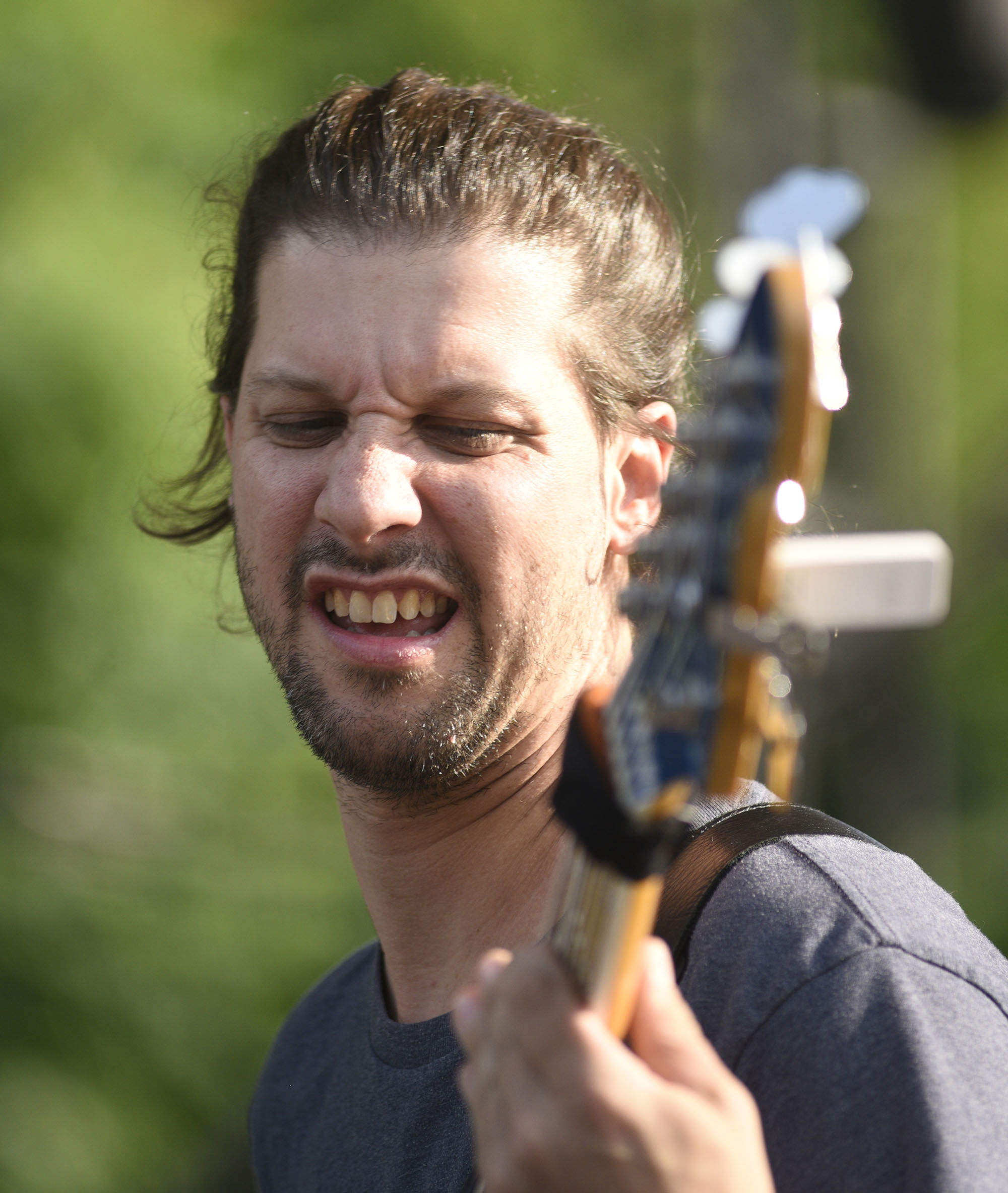 The bassist Brandon "Taz" Niederauer plays during the first selection on the Bud Lite Stage.