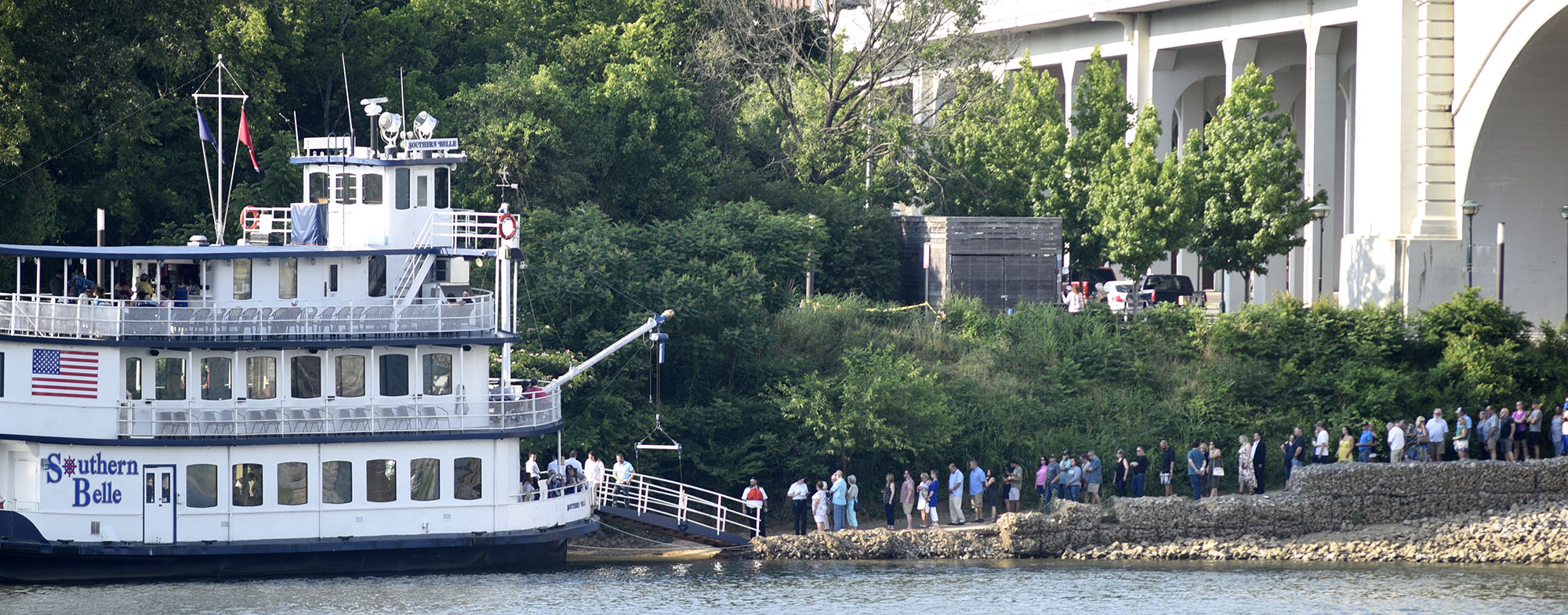 People lineup to board the Southern Belle to be ferried from the north bank of the Tennessee /river to the festival site on the south bank.